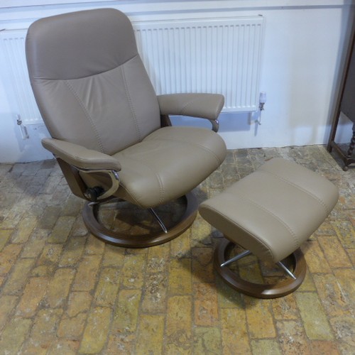 658 - A Stressless leather reclining chair and footstool - as new