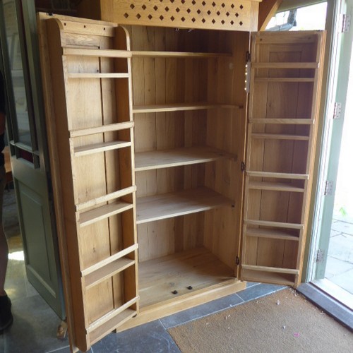 664 - A solid oak larder cupboard 198 cm tall x 105 x 59