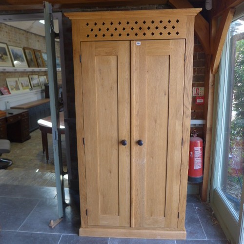 664 - A solid oak larder cupboard 198 cm tall x 105 x 59