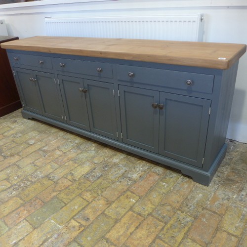 667 - A good quality sideboard with a pine top above three drawers and six cupboard doors - painted in Far... 