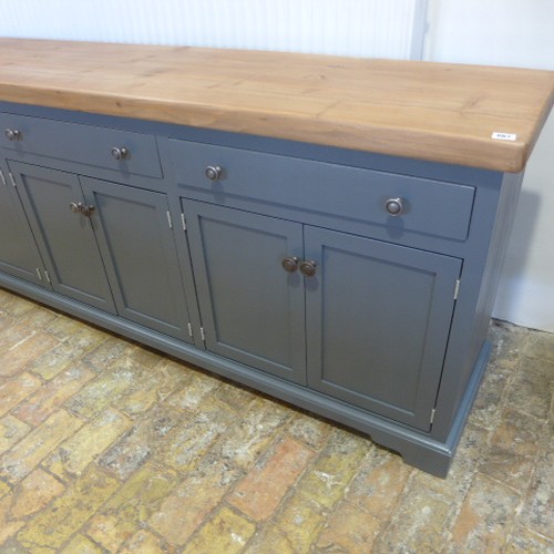 667 - A good quality sideboard with a pine top above three drawers and six cupboard doors - painted in Far... 