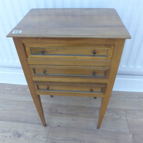 670 - A 3 drawer lamp table 71 cm tall x 44 x 31