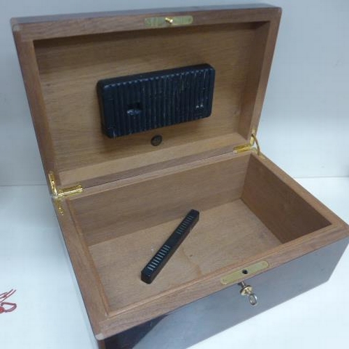 73 - A Dunhill burr wood cigar humidor with key - Height 15cm x 35cm x 23cm - in generally good condition... 