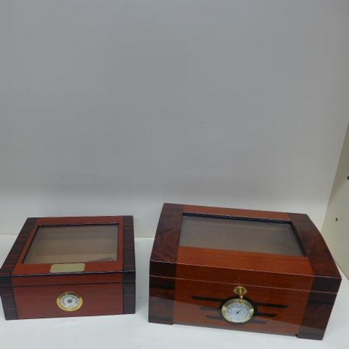 75 - Two counter top cigar humidors - the largest by Passatore - missing tray otherwise generally good - ... 