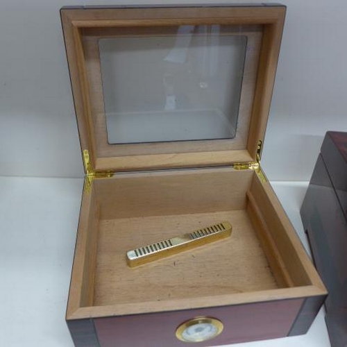 75 - Two counter top cigar humidors - the largest by Passatore - missing tray otherwise generally good - ... 