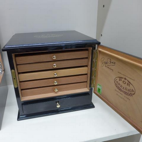 77 - Two ebonised cigar humidors - largest with five internal trays and a base drawer - some staining, no... 