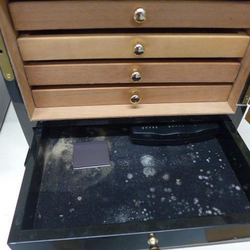 77 - Two ebonised cigar humidors - largest with five internal trays and a base drawer - some staining, no... 