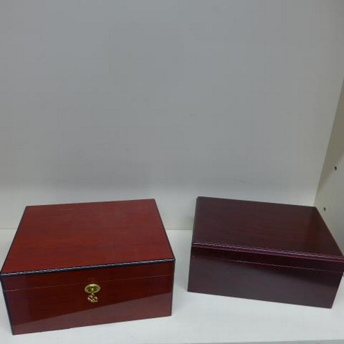 78 - Two cigar humidors one by Sikarlan with key - 15cm x 31cm x 25cm - both have some marks to exteriors... 