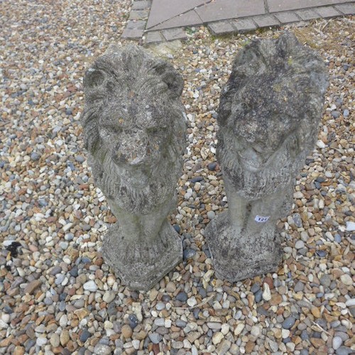 121 - A pair of stone effect lions - Height 58cm