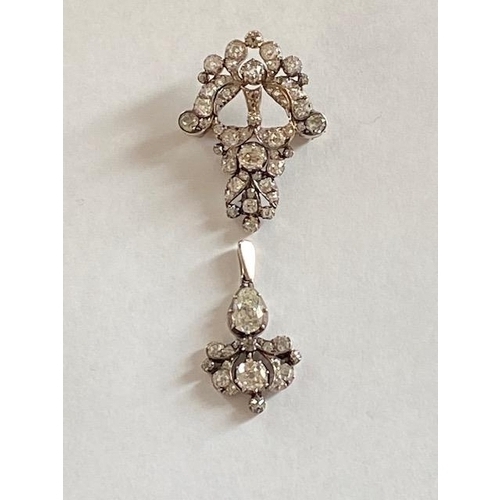 71 - A white metal and diamond brooch and pendant probably one part of a larger piece of jewellery - the ... 