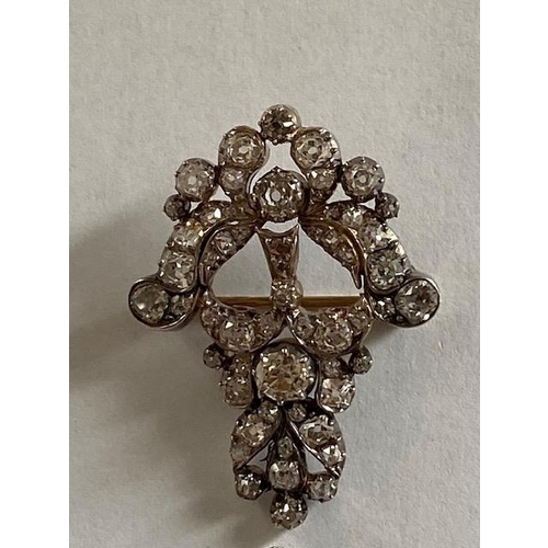 71 - A white metal and diamond brooch and pendant probably one part of a larger piece of jewellery - the ... 