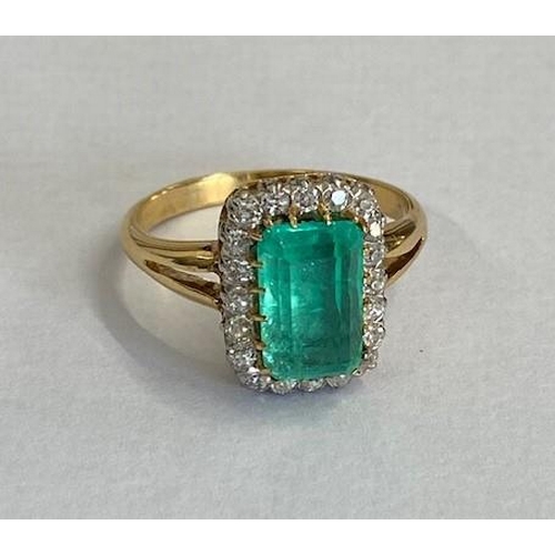 A good yellow gold emerald and diamond ring - The central rectangular round corner step cut emerald approximately 3.20ct surrounded by 20 old European cut diamonds, total approx 0.72ct - head measures 16mm x 12mm - ring size V - total weight approx 8.3 grams - tests to approx 18ct gold, not hallmarked, with AnchorCert Report - please see images for full description of stone colour etc