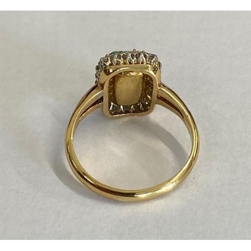 1 - A good yellow gold emerald and diamond ring - The central rectangular round corner step cut emerald ... 