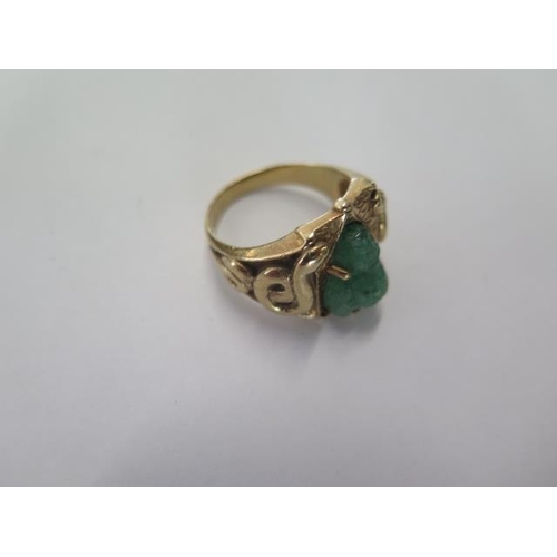 19 - An Oriental yellow gold Jade Buddha ring size R - approx weight 9.5 grams - generally good, surface ... 