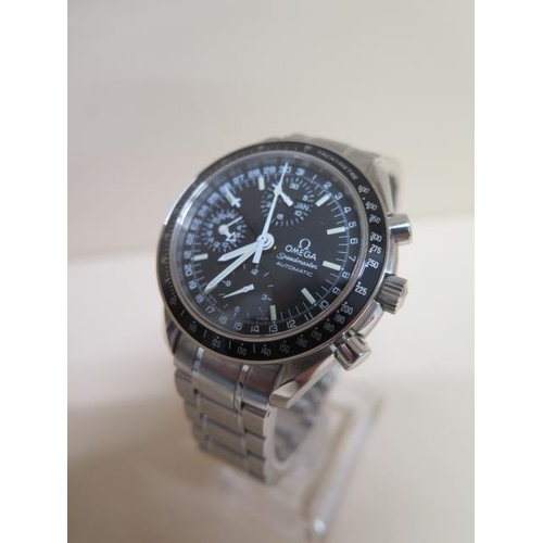 An Omega Speedmaster mk40 ref 3520.50 - in good working order and good condition (full set) with both boxes and International Warranty card