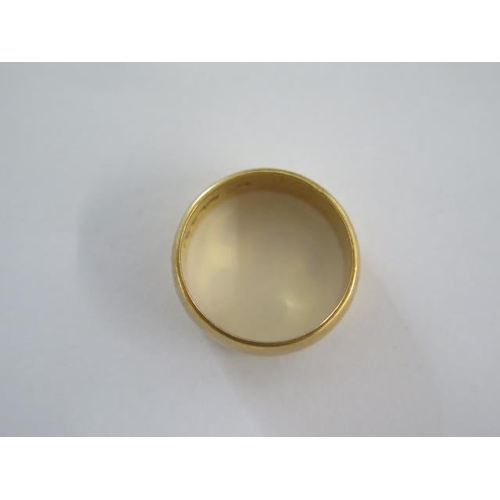 33 - A hallmarked 22ct yellow gold band ring size N - 8mm band - approx weight 9.4 grams - some usage mar... 