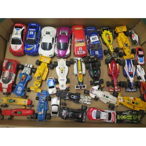 407 - A collection of 31 Scalextric and other track cars