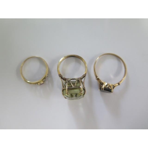 43 - Two 9ct yellow gold rings sizes X and O and a gilt metal ring size N/O - tests to approx 9ct - total... 