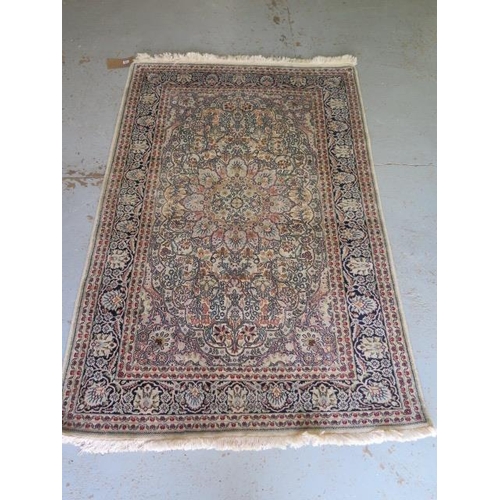 521 - A fine woven silk mix rug with cream field foliate centre with stylized boarder - 192cm x 122cm - so... 