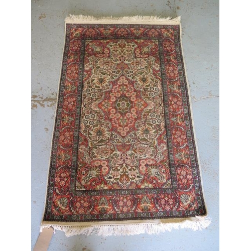 524 - A fine woven silk mix rug with cream field and foliate design - 156cm x 95cm - some wear but reasona... 