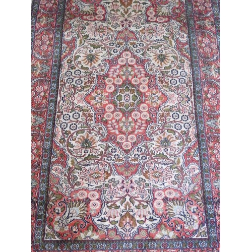 524 - A fine woven silk mix rug with cream field and foliate design - 156cm x 95cm - some wear but reasona... 