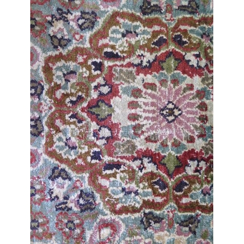 525 - A fine woven silk mix rug with cream field and foliate design - 196cm x 120cm - some wear mainly to ... 