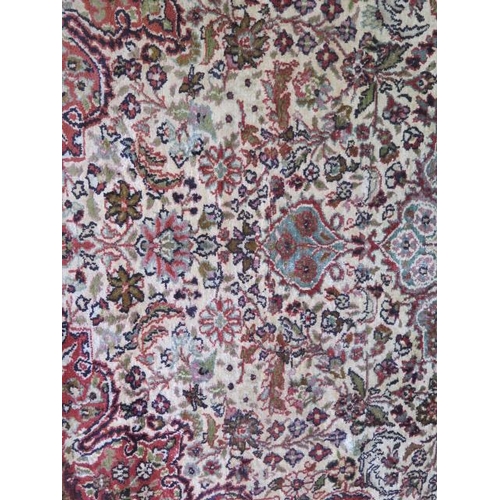 525 - A fine woven silk mix rug with cream field and foliate design - 196cm x 120cm - some wear mainly to ... 