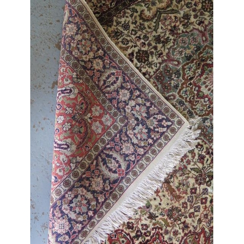 525 - A fine woven silk mix rug with cream field and foliate design - 196cm x 120cm - some wear mainly to ... 