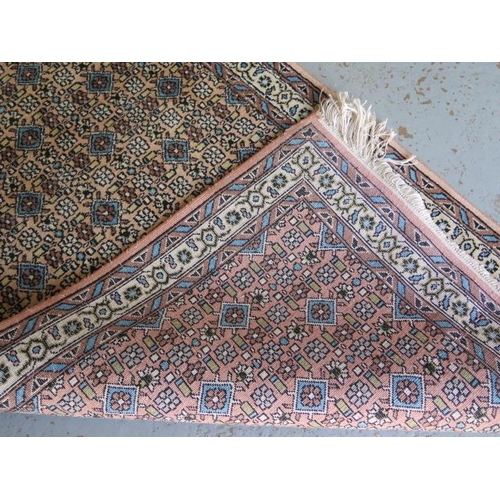 526 - A woven runner rug with a faded pink field - 315cm x 78cm - some fading but generally good