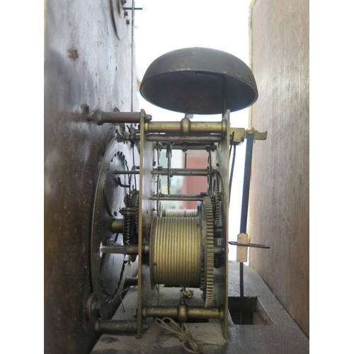 541 - An oak 8 day striking longcase clock with a brass arched 12