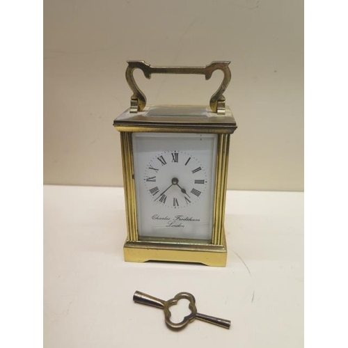 545 - A brass carriage clock - the dial signed Charles Frodsham London - overall 15cm - running, chips to ... 