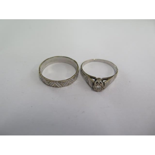 67 - A 9ct white gold band ring and a matching 9ct solitaire ring size R - total weight approx 5.3 grams