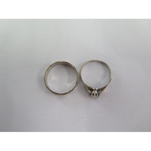 67 - A 9ct white gold band ring and a matching 9ct solitaire ring size R - total weight approx 5.3 grams