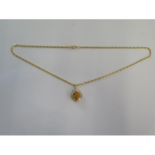 68 - A 14ct yellow gold citrine pendant - 28mm long on a 14ct 50cm chain - both marked 585 - total weight... 