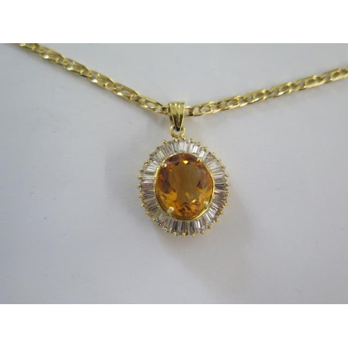 68 - A 14ct yellow gold citrine pendant - 28mm long on a 14ct 50cm chain - both marked 585 - total weight... 