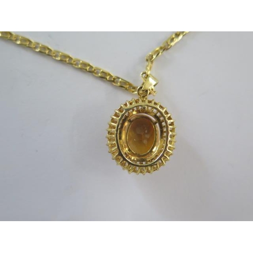 68 - A 14ct yellow gold citrine pendant - 28mm long on a 14ct 50cm chain - both marked 585 - total weight... 