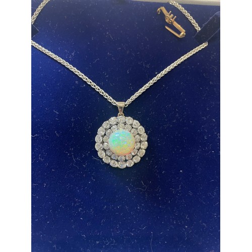 50 - A stunning Opal and Diamond pendant/brooch 28.5mm diameter with a centre cabochon Opal approx 13.5mm... 