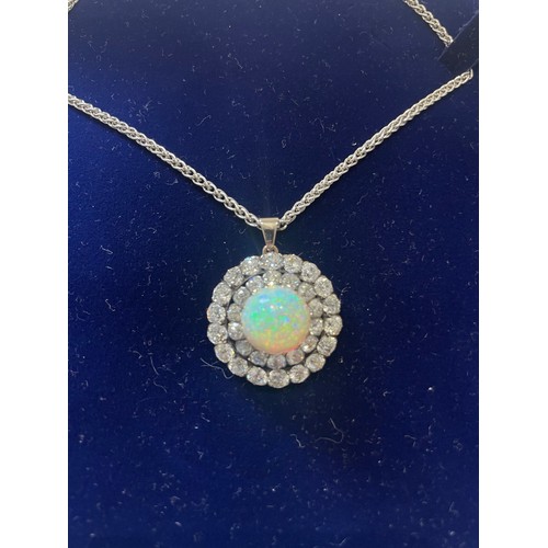 50 - A stunning Opal and Diamond pendant/brooch 28.5mm diameter with a centre cabochon Opal approx 13.5mm... 