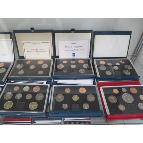 205 - Sixteen United Kingdom proof coin sets running from 1984 to 1998 with a duplicate 1993 set