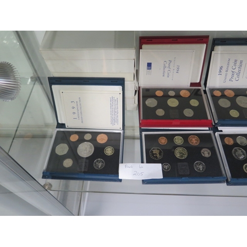 205 - Sixteen United Kingdom proof coin sets running from 1984 to 1998 with a duplicate 1993 set