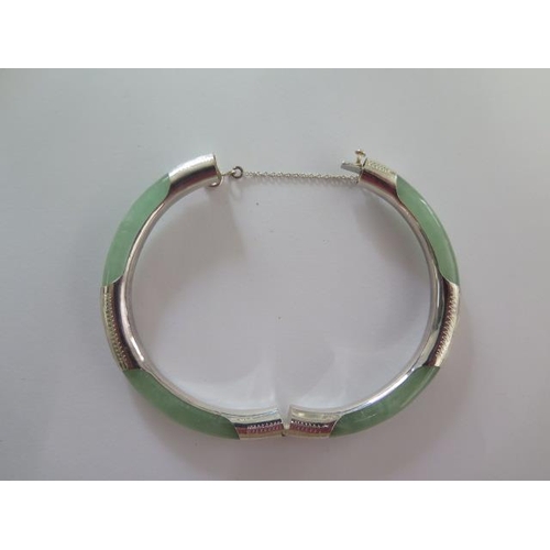 97 - A jade/jadeite and 925 silver hinged bangle - Diameter 7cm - good condition