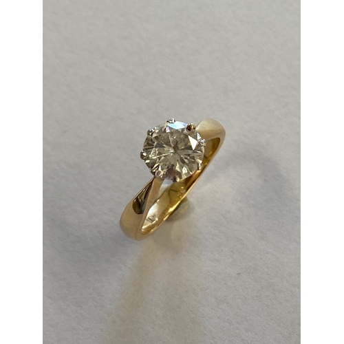 1 - An 18ct yellow gold and platinum solitaire diamond ring - the round brilliant cut diamond approx 1.5... 