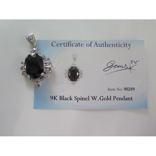 114 - A 9ct white gold black spinel pendant - Length 4cm - approx weight 10.7 grams - in good condition, w... 