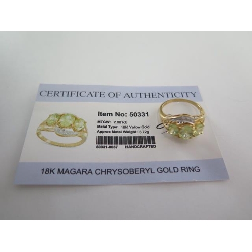 120 - An 18ct yellow gold Magara Chrysoberyl ring size P - approx weight 4.5 grams with certificate - good... 