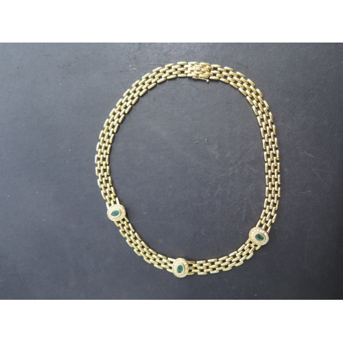 127 - An 18ct yellow gold emerald and diamond necklace with Egyptian marks - Length 39cm, heads 13mm x 11m... 