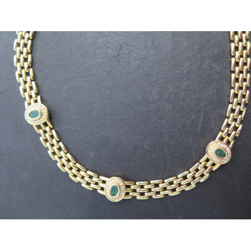 127 - An 18ct yellow gold emerald and diamond necklace with Egyptian marks - Length 39cm, heads 13mm x 11m... 