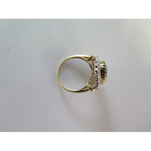 132 - A 9ct yellow gold diamond and sapphire ring, head size approx 19mm x 17mm - ring size approx P - In ... 