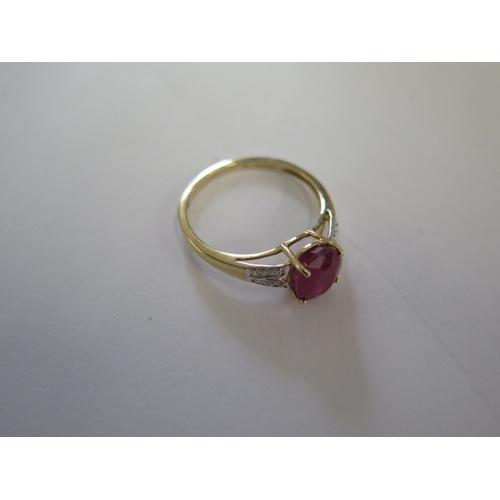 135 - A 9ct yellow gold ruby and diamond ring, head size approx 16mm x 9mm - ring size approx R - In good ... 