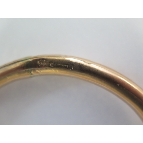 141 - A 9ct gold hollow bangle - 8.5cm external - approx weight 18.4 grams - some dents and repairs