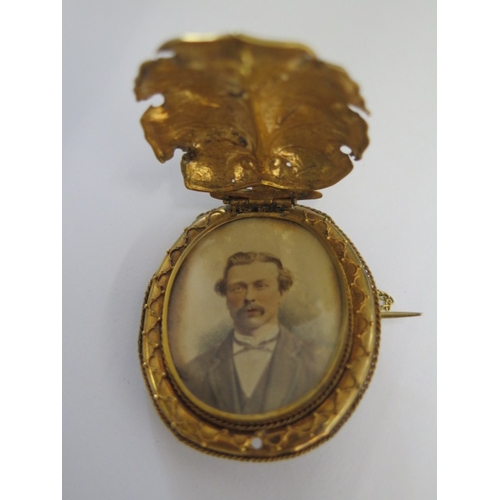 142 - A gold plated octagonal bangle - 8cm wide external - and a gilt metal mourning brooch